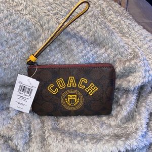 Coach Corner Zip Wristlet In Signature Canvas With Varsity Motif